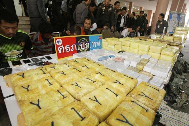Methamphetamine in both pills and crystal form are on display at a police briefing following the arrests of 14 suspects in four cases at the Narcotics Suppression Bureau in Bangkok on Saturday. (Photo by Apichit Jinakul)